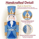 Handcrafted detail infographic featuring a blue, white, and gold Christmas nutcracker with close-up views highlighting vivid hand-painted details and durable polyresin construction.