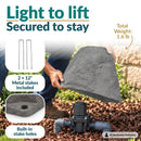 Infographic showing a lightweight, tall, tapered gray faux rock cover being lifted over a sprinkler valve in a landscaped garden. Text highlights its 1.6 lb weight, two included 12-inch metal stakes, and built-in stake holes for secure outdoor placement.