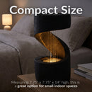 Compact black spiral tabletop fountain with warm built-in lighting and cascading water, measuring approximately 7.75" x 7.75" x 14" for small indoor spaces.