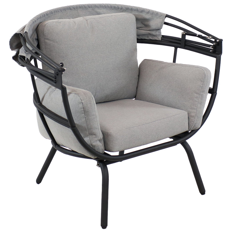 Gray egg chair with retractable shade pulled down.