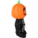 Side view of the black skeleton with pumpkin head inflatable. 