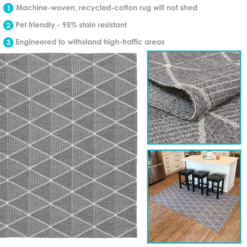 5x7 gray lattice style indoor rug laid out over hardwood floor next to kitchen island with square black bar stools
