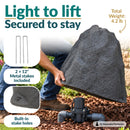 Dark gray faux rock utility cover being lifted to reveal outdoor plumbing. Text highlights its lightweight 4.2 lb construction, two included 12-inch metal stakes, and built-in stake holes for secure ground installation.