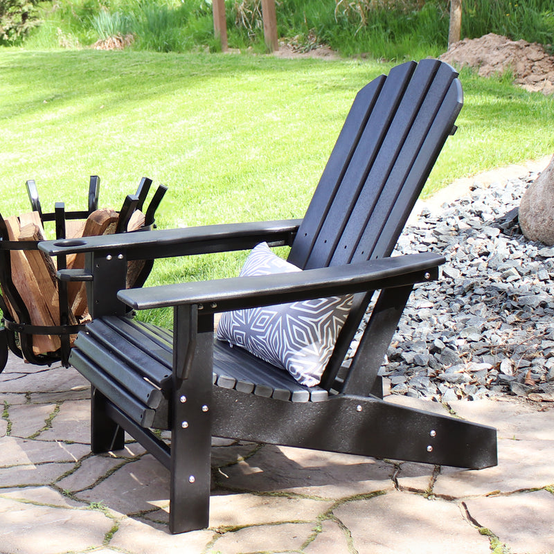 Single, black Adirondack chair with gray, geometric lumbar pillow.