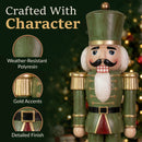 Close-up of a green and red Christmas nutcracker statue with gold accents, featuring callouts for weather-resistant polyresin, gold accents, and detailed finish.