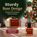 Christmas nutcracker decoration featuring a red, green, black, and gold uniform, holding a festive wreath and candy cane while standing on a sturdy square Merry Christmas base. A close-up highlights the supportive base designed for stable placement on flat surfaces during seasonal displays.