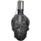 Front view of a black, clear skull torch with metal snuffer cap and chain.