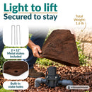 Infographic showing a lightweight, low, rounded dark brown faux rock cover being lifted over a sprinkler valve in a landscaped garden. Text highlights its 1.6 lb weight, two included 12-inch metal stakes, and built-in stake holes for secure outdoor placement.