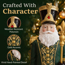 Close-up of a decorative Santa figure in a green, burgundy, and gold outfit, highlighting the weather-resistant polyresin construction, gold accents, and detailed finish. Text reads “Crafted With Character.”