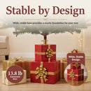 Present Pile Decorative Christmas Tree Base shown supporting an artificial Christmas tree, featuring a wide, stable design and substantial 13.8-pound base for a sturdy foundation.