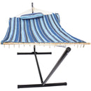 Blue striped pad and pillow tied to a rope hammock on the black hammock stand.