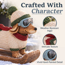 Close-up infographic of a winter dachshund statue highlighting weather-resistant MgO, intricate texture, and vivid hand-painted detail.
