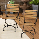 Small folding bistro dining armchairs placed on the patio.
