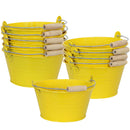 Yellow galvanized steel bucket with handle filled with markers on a wooden side table