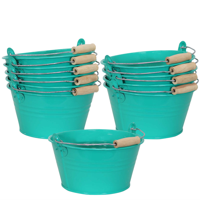 Teal galvanized steel bucket with handle filled with markers on a wooden side table
