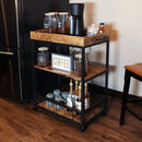 Industrial style three-shelf bar cart used in a kitchen as a coffee bar station