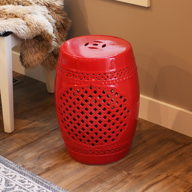 Red lattice ceramic garden stool sitting on hardwood floor
