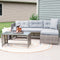 Woman enjoying a glass of wine while relaxing outdoors on the gray Longford low-back patio sectional sofa