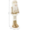 Face and beard of off-white and gold nutcracker gnome plush figurine.