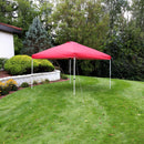 Red 12'x12' pop up canopy with white frame set up on a backyard lawn.