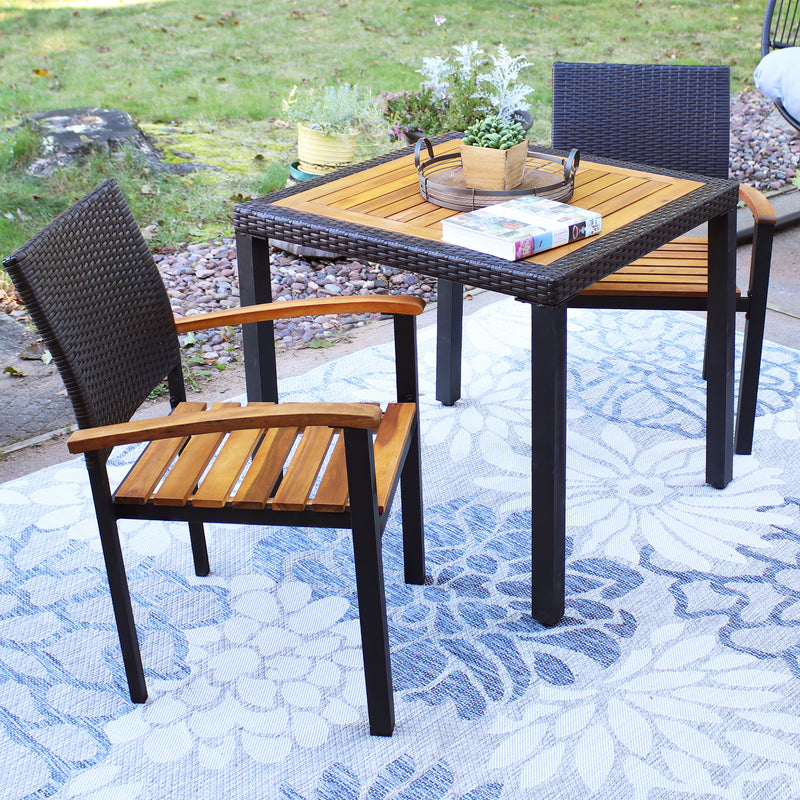 3 piece outdoor dining set with wood tabletop and chairs with wood seat and rattan backrest
