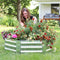 Woman kneeling next to the hexagon, silver raised garden bed outside tending to plants