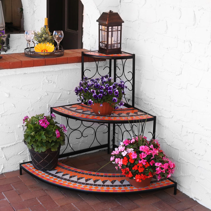 top tier of orange mosaic corner plant stand