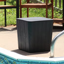 Black faux wood 2-in-1 storage box sitting next a pool on a sunny day.