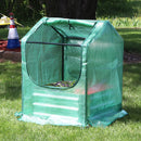 green plastic cover with zipper opening and black frame for mini greenhouse
