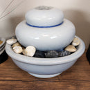 gray ceramic indoor tabletop water fountain with rocks