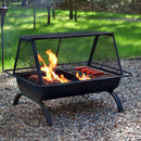Hot dogs roasting on a rectangle outdoor cooking fire pit with a spark screen at a campground.
