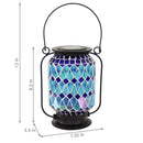 Nighttime view of the cool blue mosaic glass lantern showing the brightness of the LED solar slight.