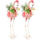 Two pink flamingos planters with lush green plants