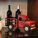 Metal wine truck on counter with wine