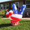Peace sign yard inflatable with American flag stripes and stars, on the bottom are the letters USA.