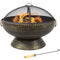 Steel, bronze fire bowl with spark screen burning a fire on a stone patio.
