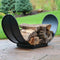 Outdoor heavy-duty steel 3-foot log rack sitting on a stone patio filled with wood