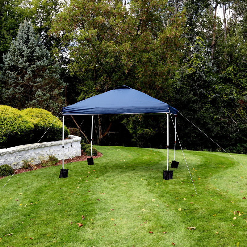 blue 10'x10' pop up canopy with white frame and sandbags