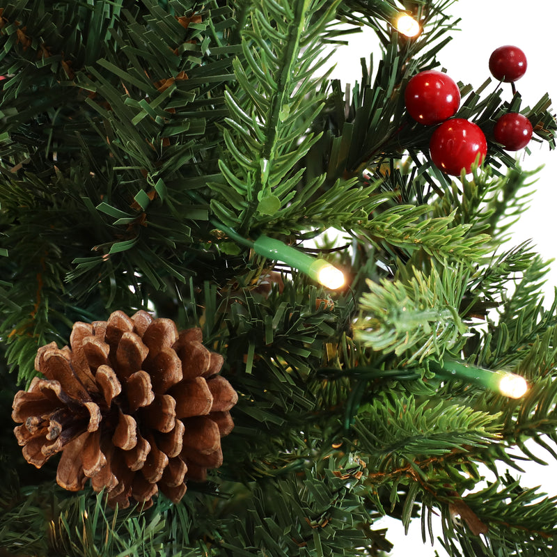 pre-lit artificial christmas tree with pinecones and berries