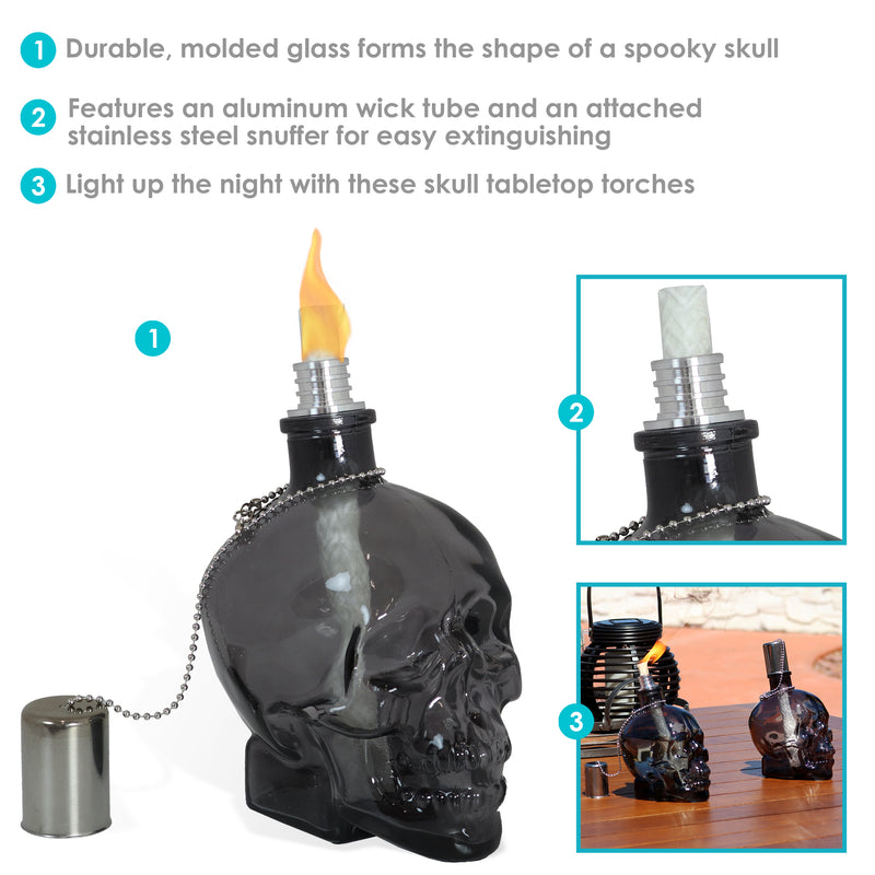 Front view of a black, clear skull torch with metal snuffer cap and chain.