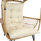 Light brown wicker armrest of comfort wicker egg chair.