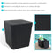 Black, faux woodgrain side table with storage with lid off, resting on the side of the box.