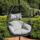 hanging egg chair with gray cushions