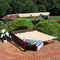 beige double person outdoor lounging bed with canopy and matching pillows