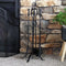 Indoor 5-piece steel fireplace tools next to indoor fireplace with fireplace screen