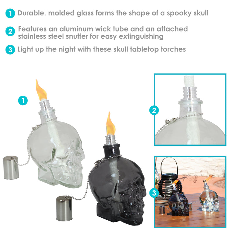 Front view of one white and one black clear skull torches with metal snuffer caps.